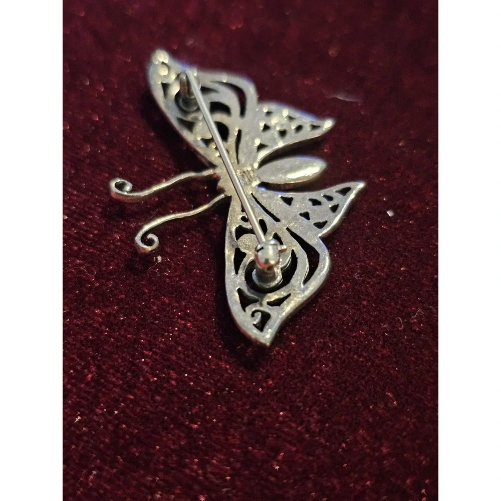 sterling butterfly pin. Marked 925 and hallmark CFT. About 1.5‎ brouch